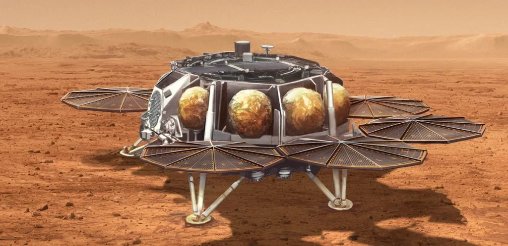 L'illustration montre une proposition de la NASA pour le Sample Retrieval Lander qui transporterait également une petite fusée (d'environ 3 mètres de haut) appelée Mars Ascent Vehicle à la surface martienne.