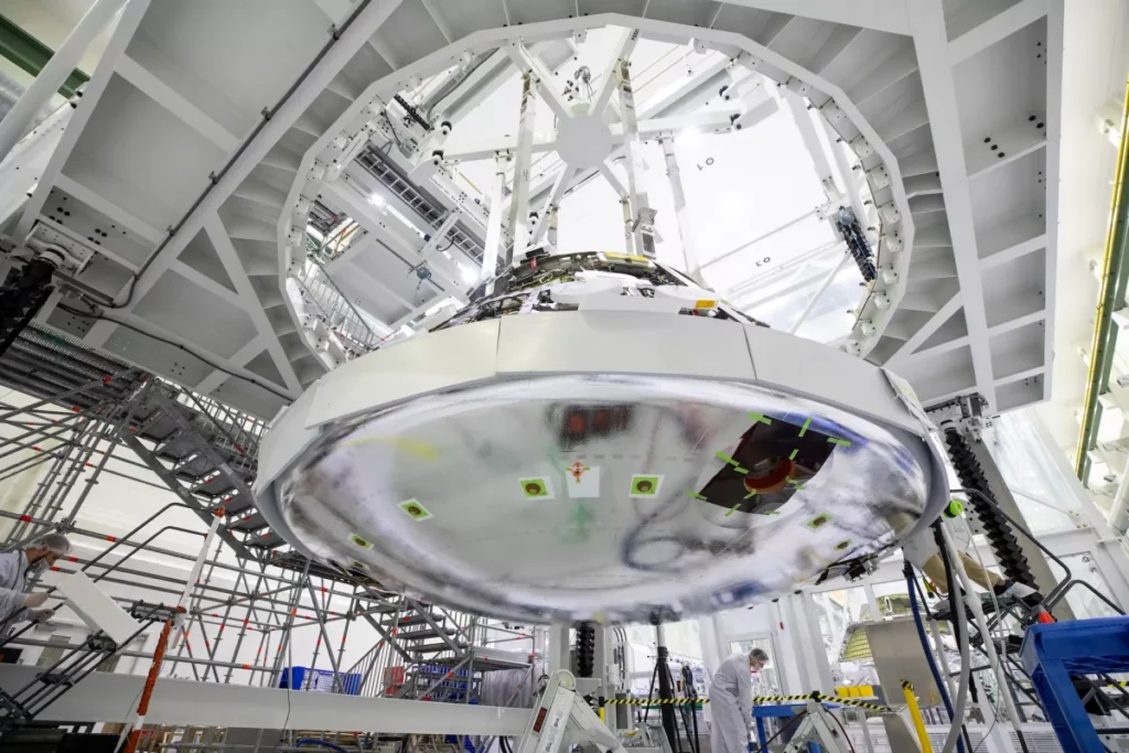 NASA technicians at Kennedy Space Center have completed the assembly of the heat shield on Orion, which is part of the Artemis 2 mission